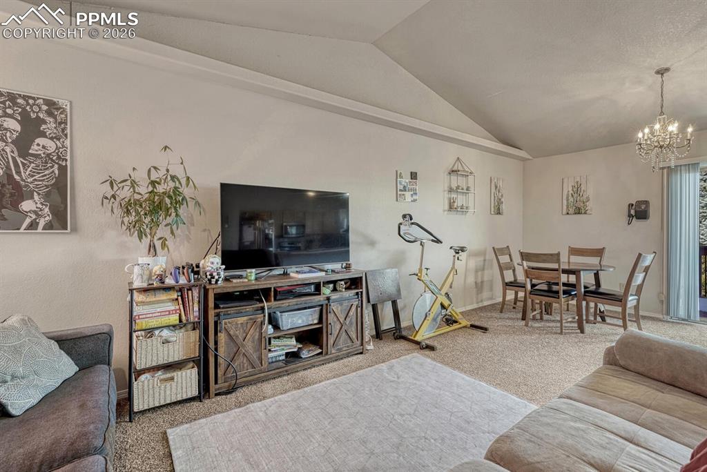 Image 11 of 40: living room, open to dining area