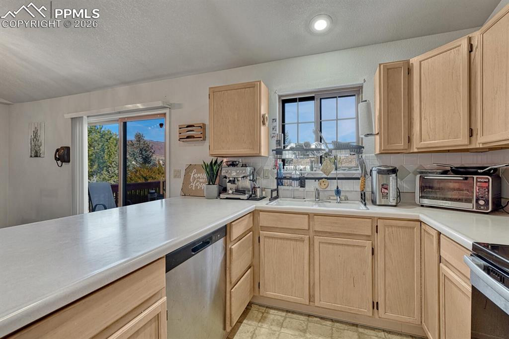 Image 5 of 40: Large kitchen with walkout to deck