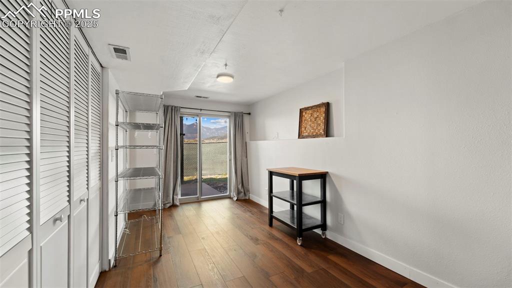 Image 25 of 38: Access to back patio through sliding glass doors.