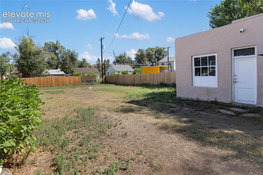 Image 8 of 29: Garage and huge yard