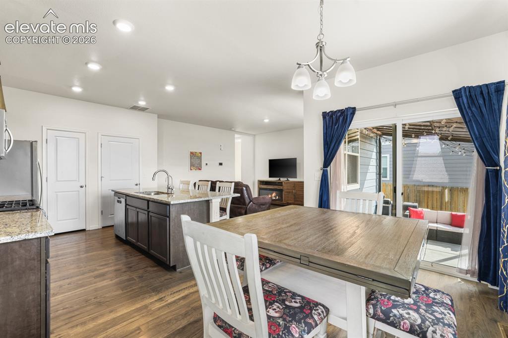 Image 20 of 42: Stainless steel appliances include a gas range oven, built-in microwave, di
