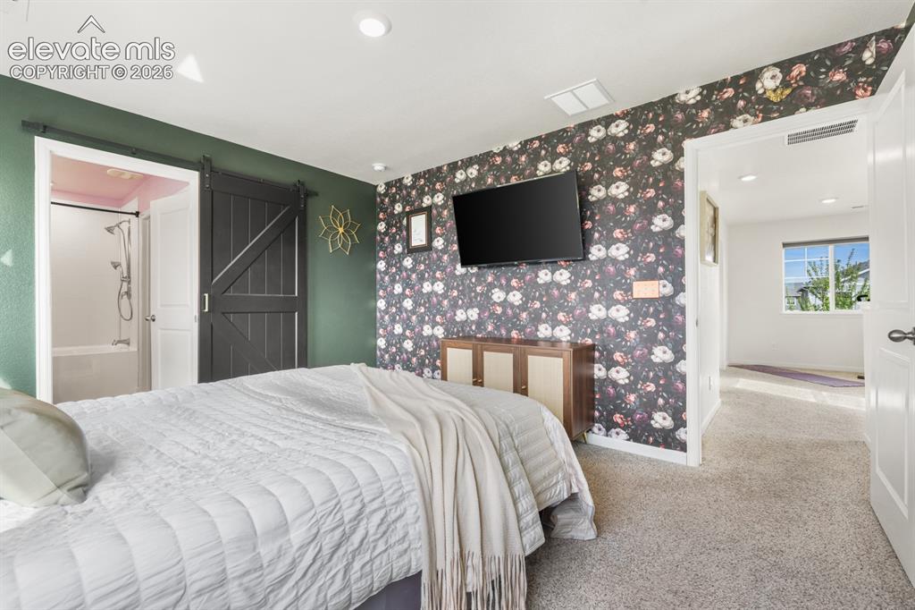 Image 27 of 42: Upper level versatile Loft with neutral carpet.