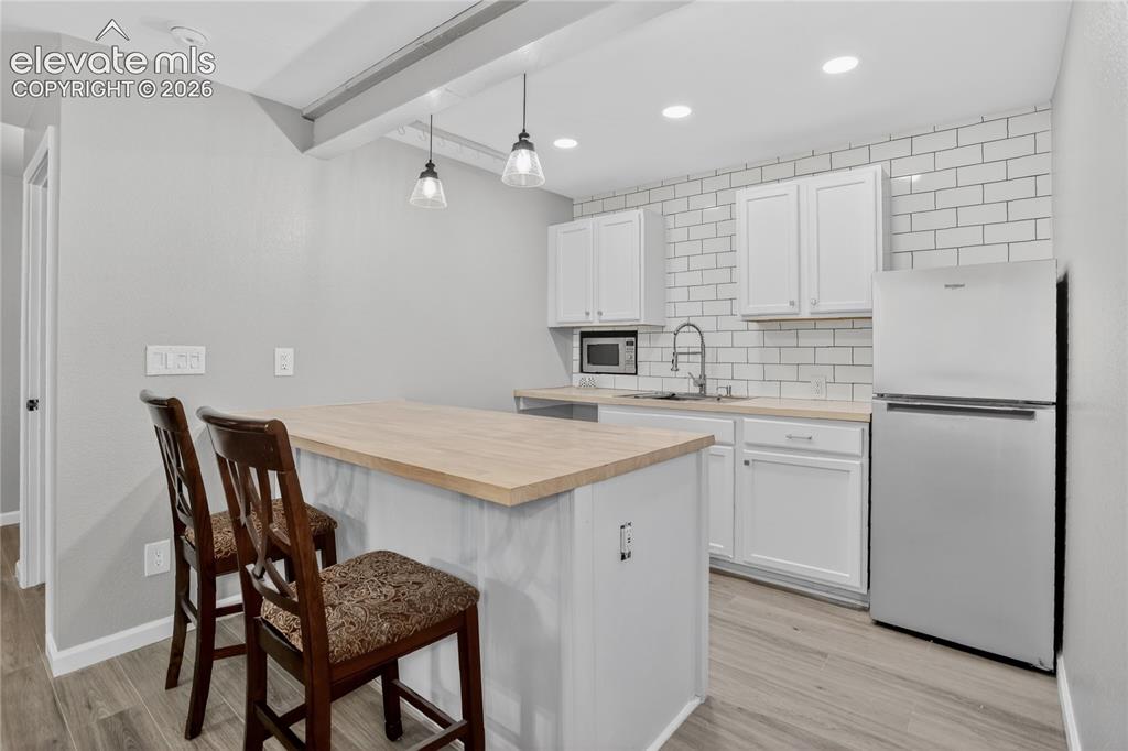 Image 18 of 27: Kitchenette off of family room - lower level
