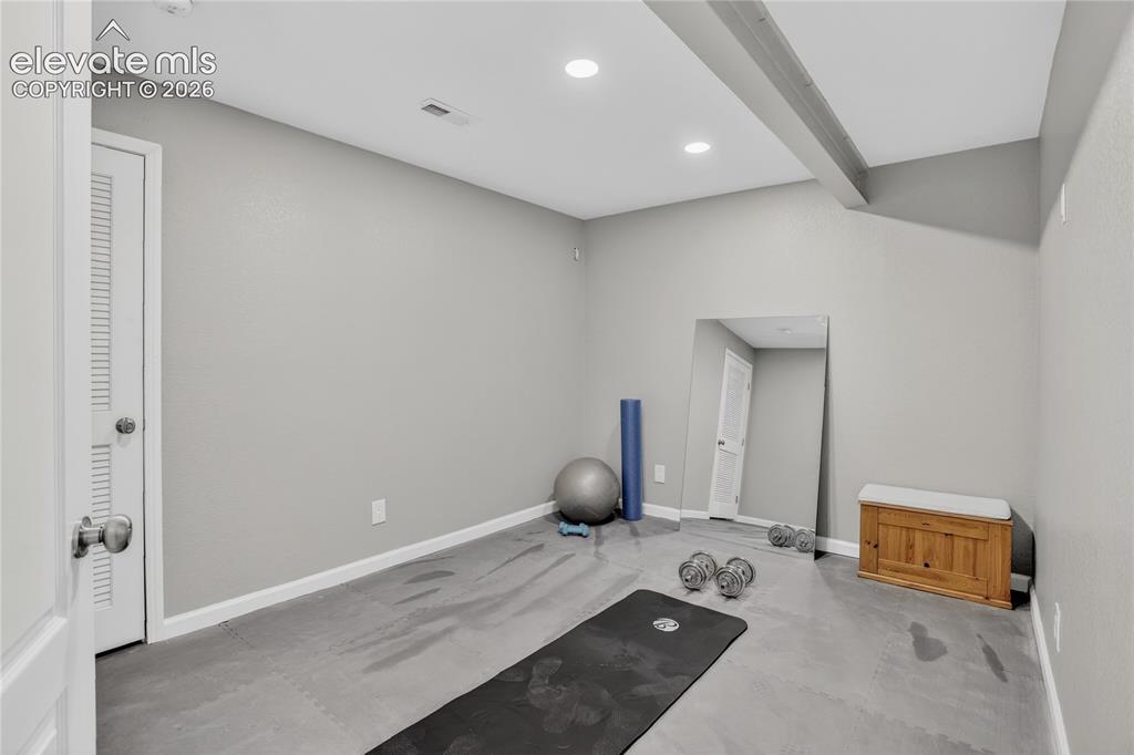 Image 22 of 27: Lower level bonus room - currently used as a workout room