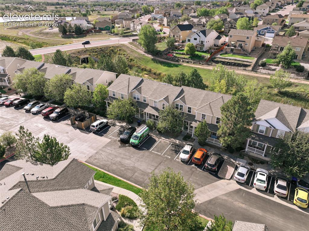 Image 10 of 34: front aerial view with designated parking spots