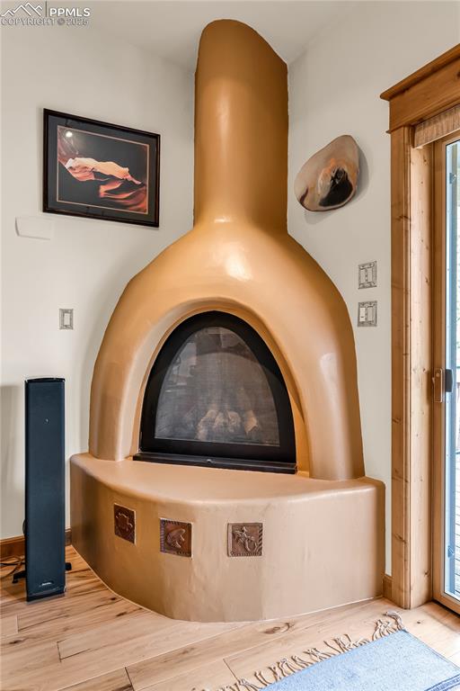 Image 22 of 43: Adobe Kiva fireplace