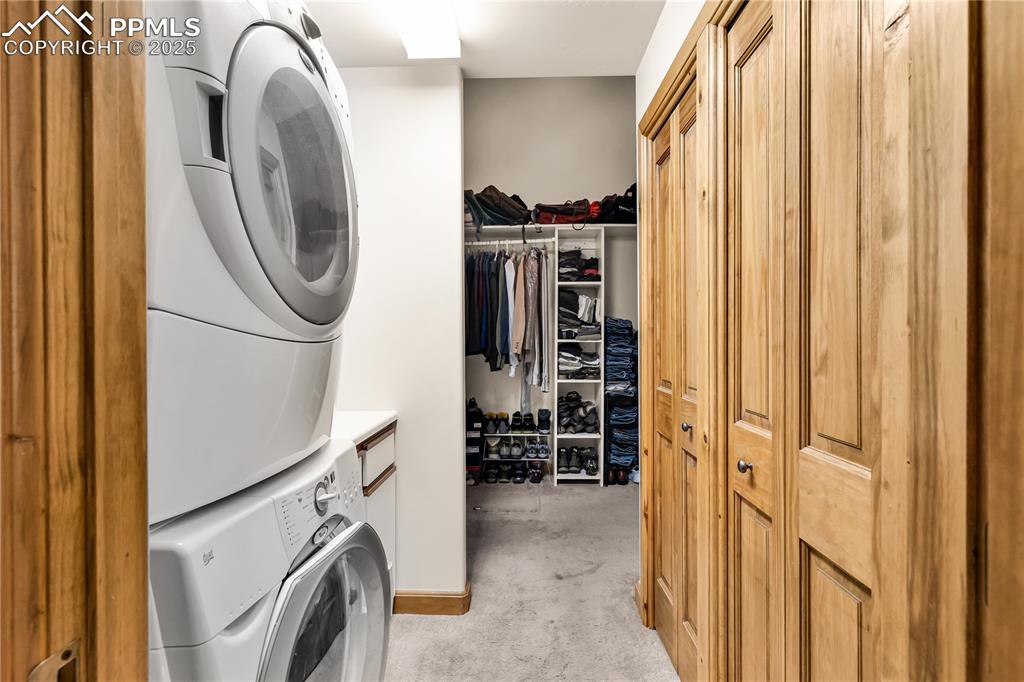 Image 31 of 43: Laundry area right off of walk in closet. Also has a door that goes out to 