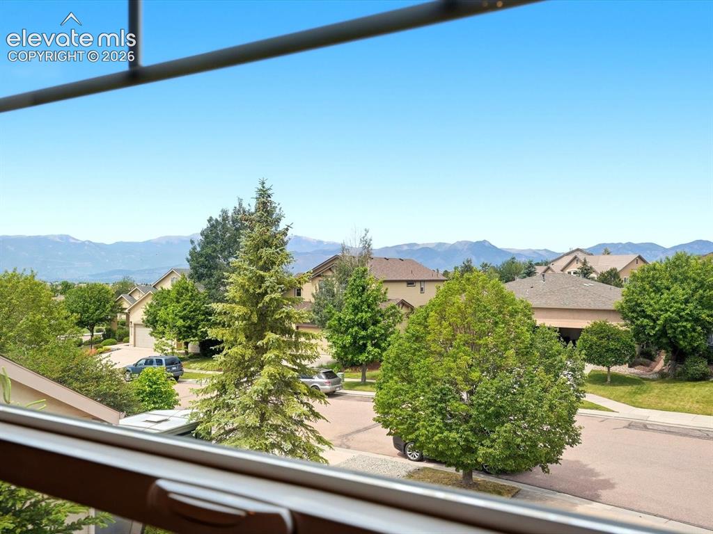 Image 23 of 39: Mountain views from primary bdrm