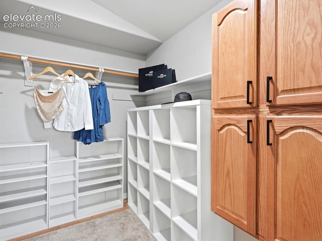Image 26 of 39: Walk-in primary closet