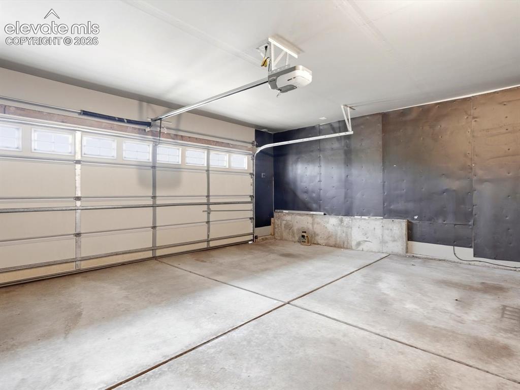 Image 36 of 39: Garage has EV charger