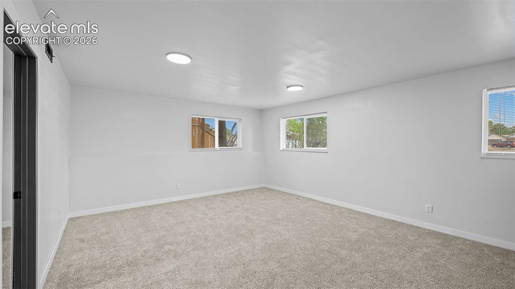 Image 16 of 21: Spacious family room or rec room in basement