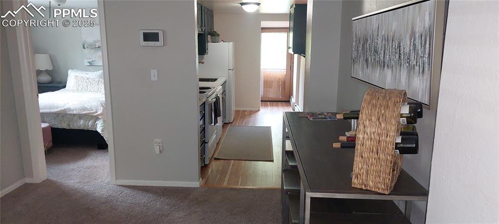 Image 14 of 46: Kitchen with light carpet