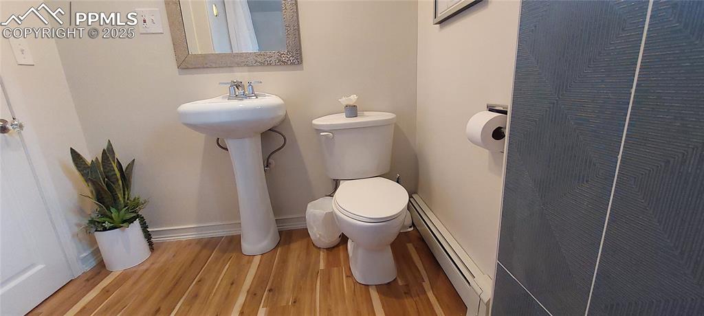 Image 22 of 46: Full bathroom featuring LVP floors, New tile and fixtures, tub / shower com