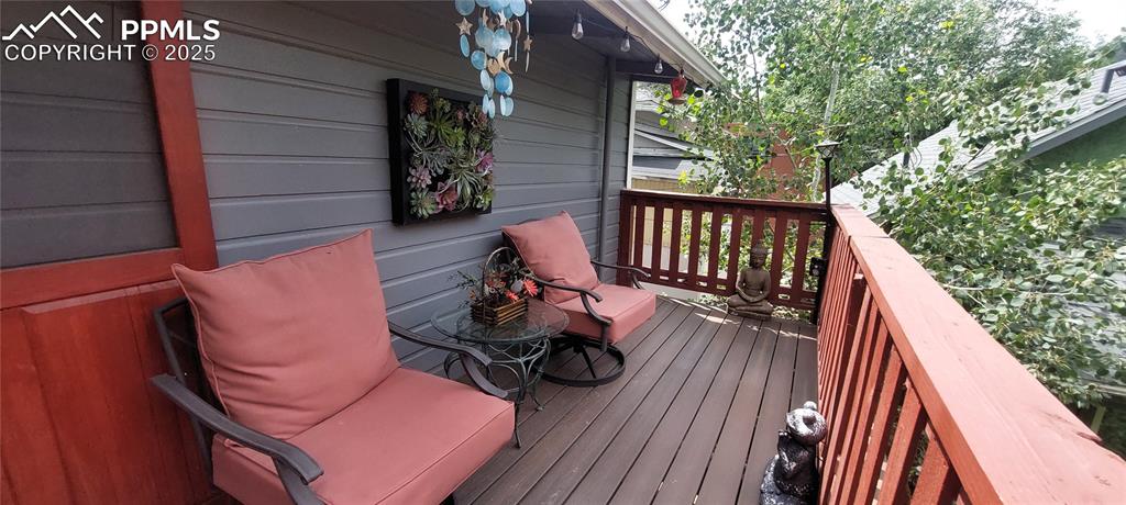 Image 28 of 46: View of composite decking and wooden terrace