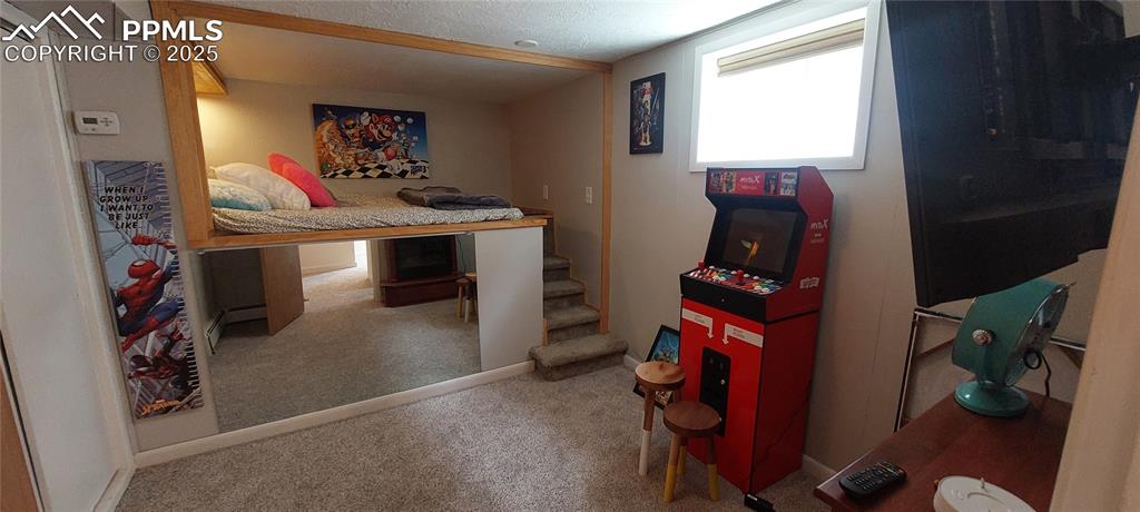 Image 37 of 46:  2nd Bedroom with carpet and baseboards and extra storage under bed