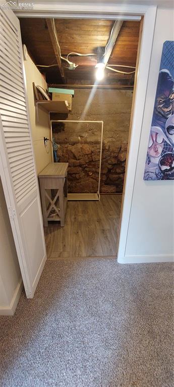 Image 39 of 46: View of lower level laundry area and Boiler, HW heater and open showerarea