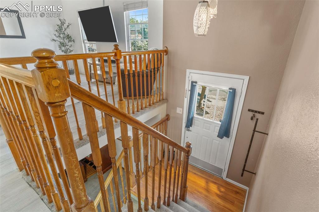 Image 4 of 29: Staircase featuring wood finished floors and baseboards