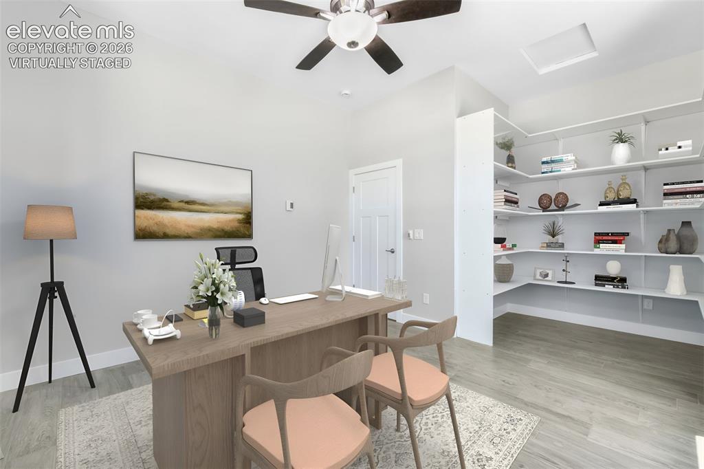 Image 24 of 50: Office and can be another main level virtually staged bedroom