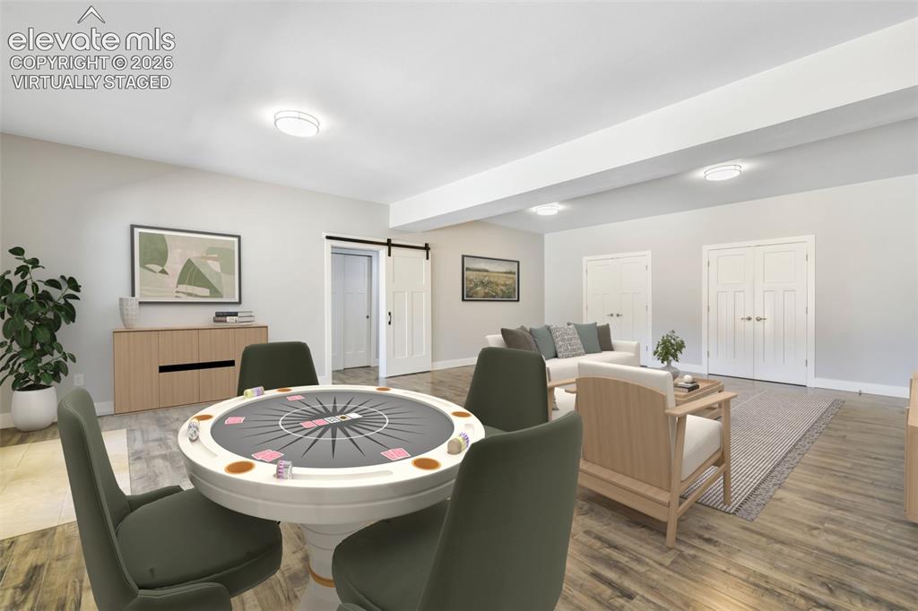 Image 29 of 50: Huge family room for entertaining in basement virtually staged