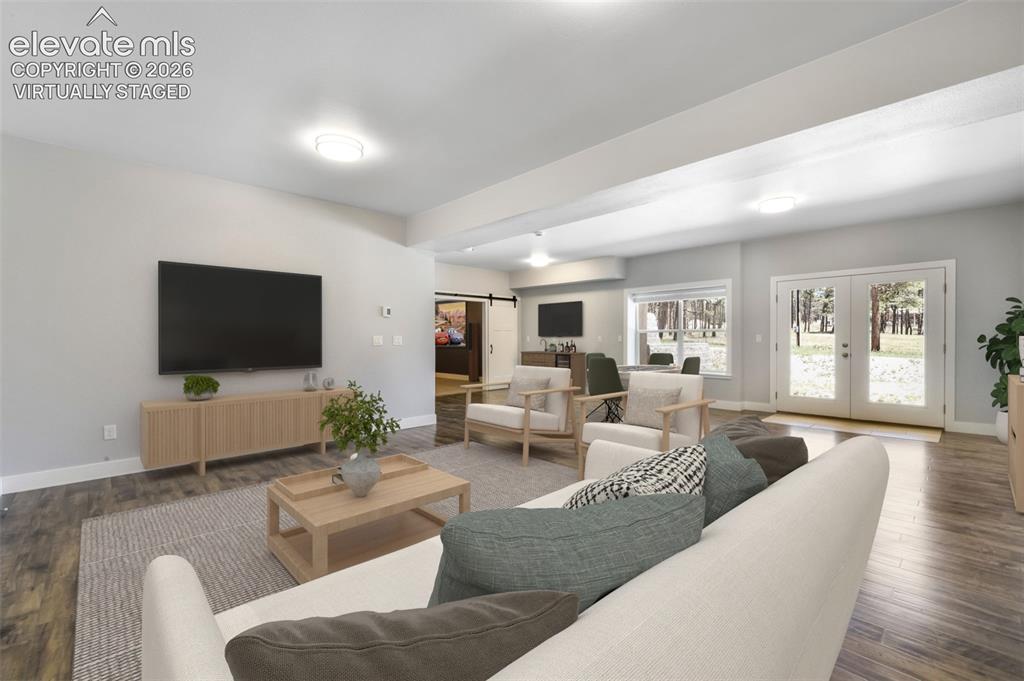 Image 31 of 50: Huge family room for entertaining in basement virtually staged
