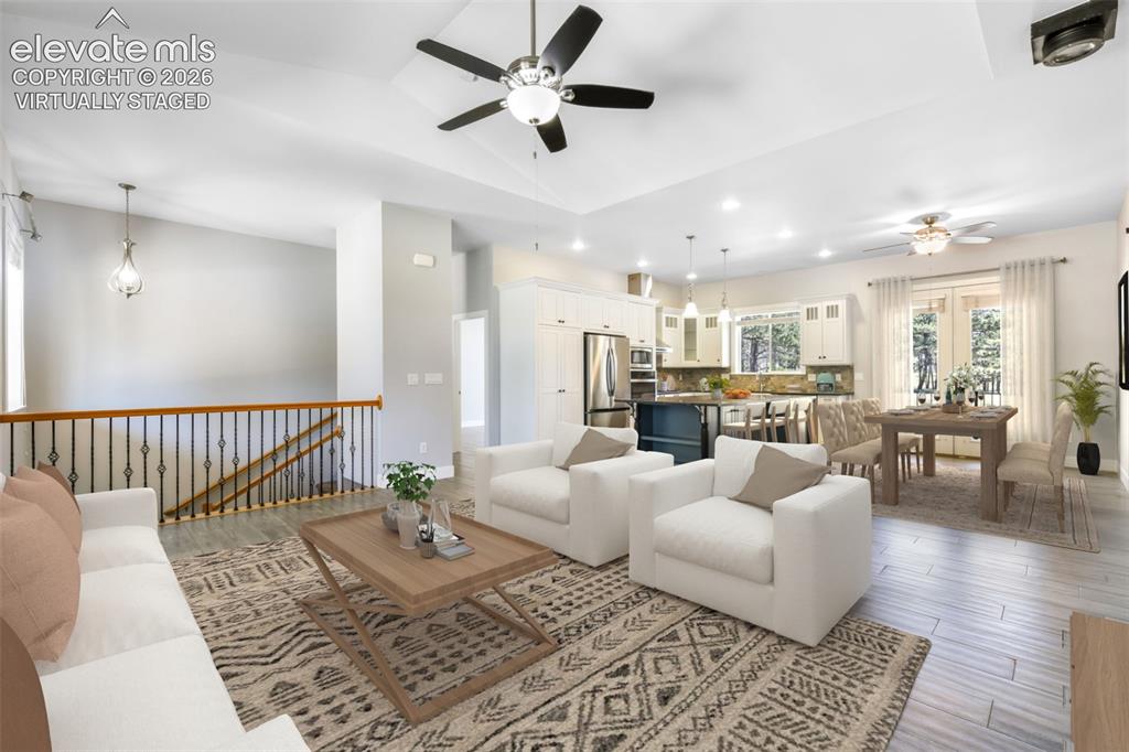 Image 7 of 50: Open concept main level virtually staged