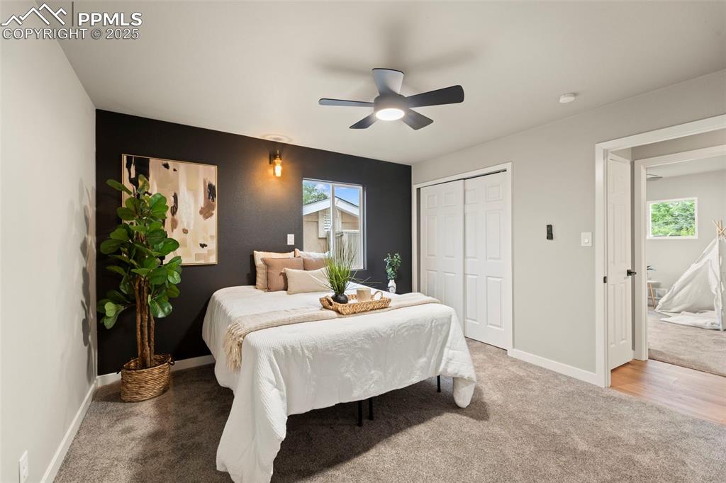 Image 19 of 31: Carpeted bedroom featuring baseboards, a ceiling fan, and a closet