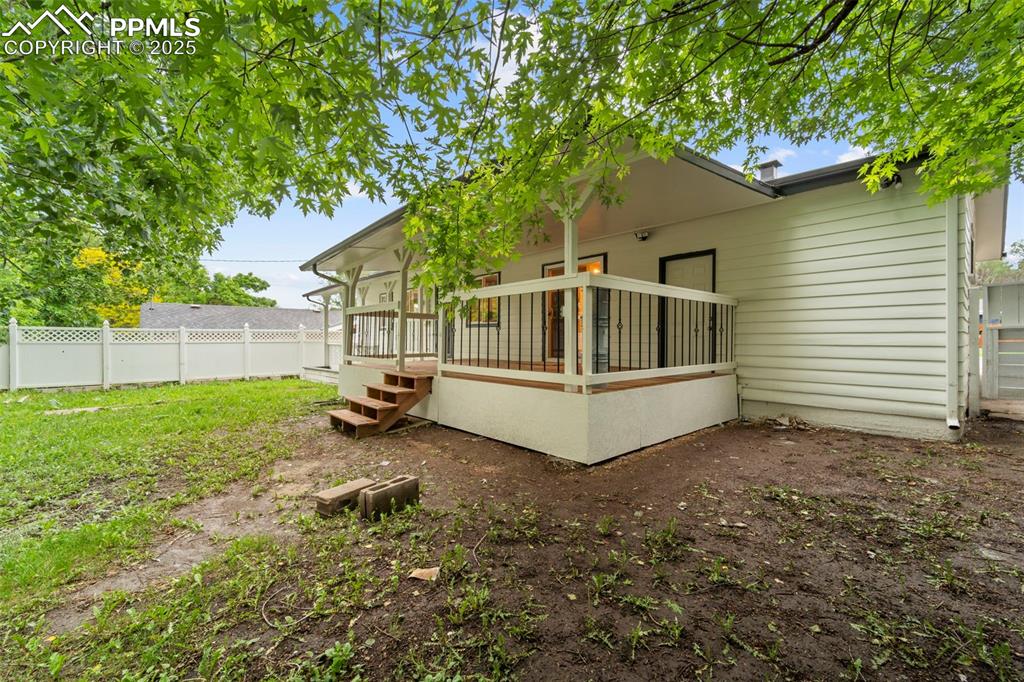 Image 8 of 31: Fenced in back yard