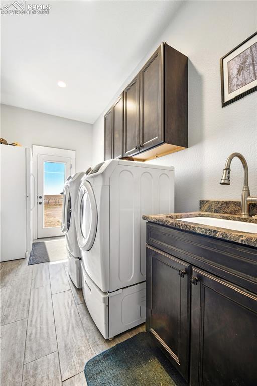 Image 27 of 49: Mud Room/Laundry with Freezer, Sink and Washer/Dryer (Included)