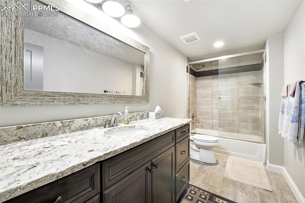 Image 33 of 49: Lower-Level Bathroom