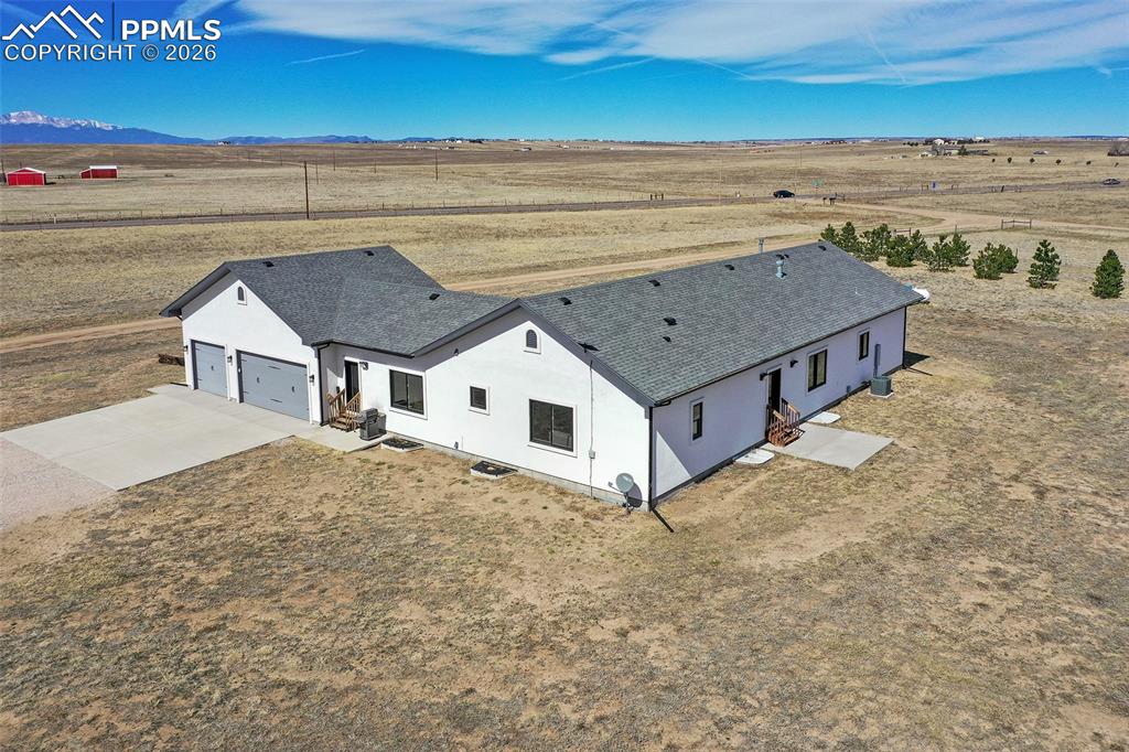 Image 36 of 49: Aerial View of the Back Yard, Drive and 3 Car Garage