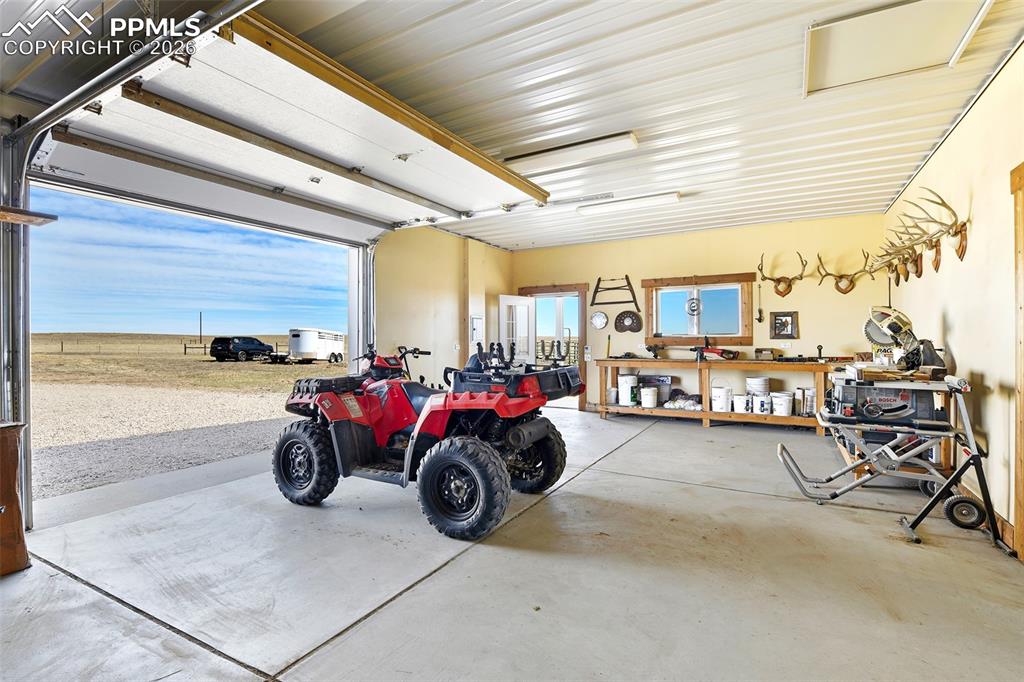 Image 40 of 49: Four Stall Barn with Overhang, Side Entry and Overhead Door.