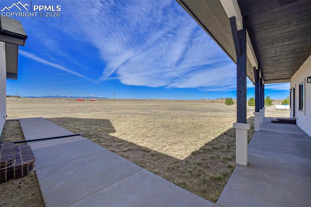 Image 6 of 49: Front Yard with Converd Porch off Master and Entry Areas