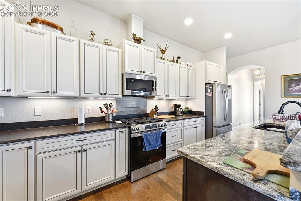 Image 7 of 49: Front Yard with Converd Porch off Master and Entry Areas