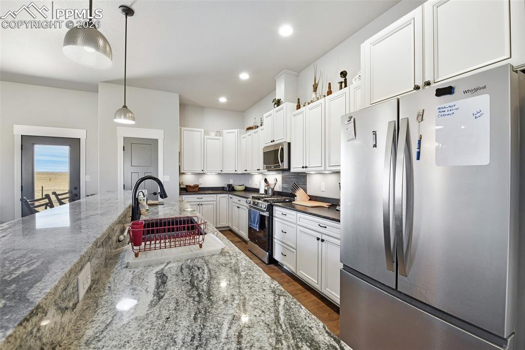 Image 8 of 49: Beautiful Kitchen with Granite Counter Tops, Breakfast Bar, Wine Refrigerat