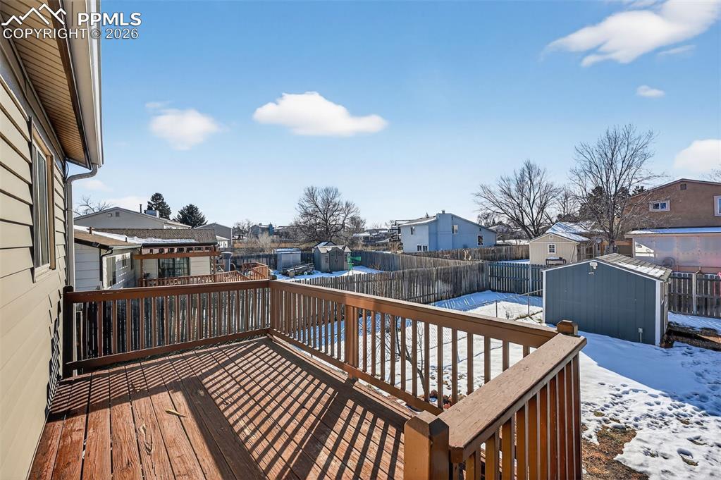 Image 19 of 26: The oversized deck features lots of space to entertain or relax