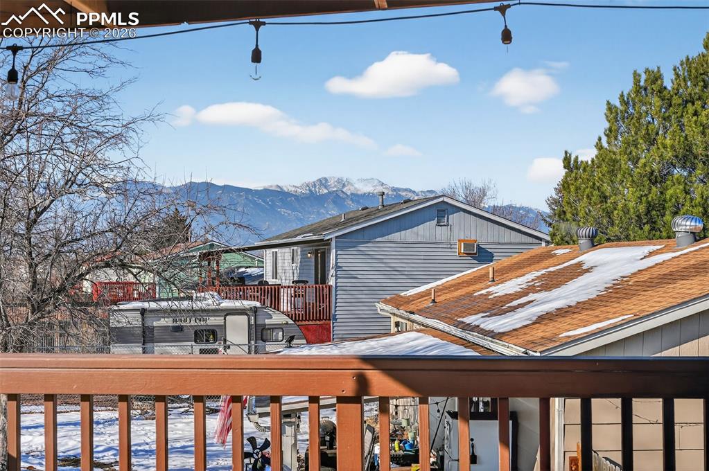 Image 3 of 26: Enjoy the stunning Pikes Peak view from the spacious covered deck!