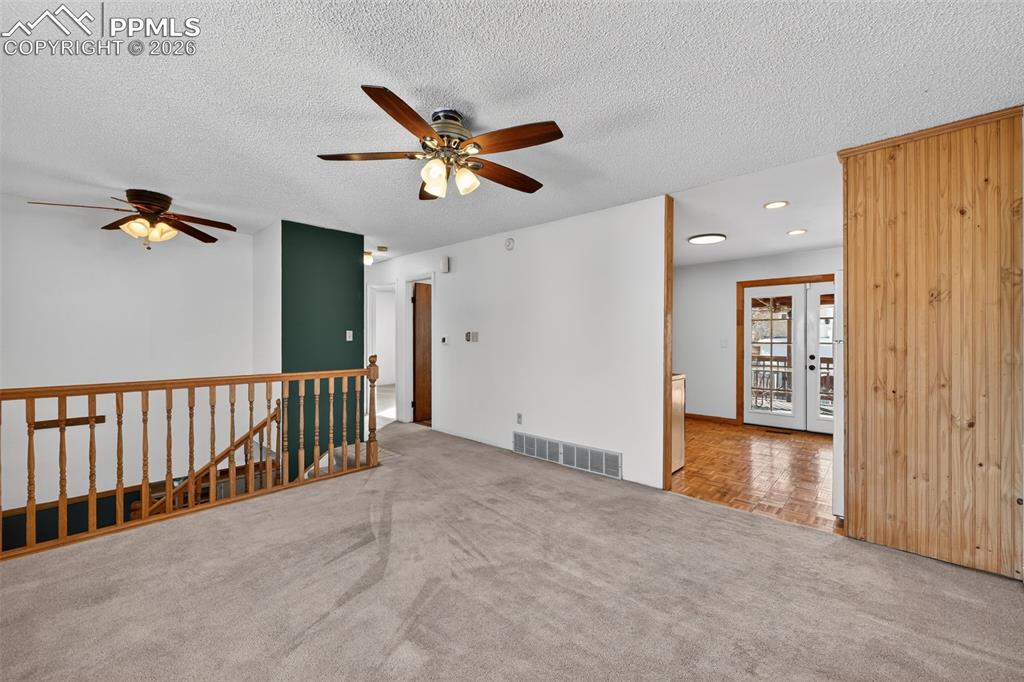 Image 4 of 26: Generously sized living room features tons of natural light from large wind