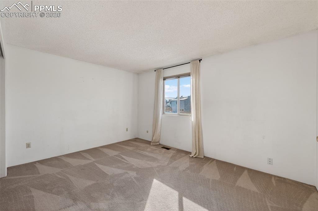 Image 8 of 26: Primary bedroom features recently remodeled ensuite bath