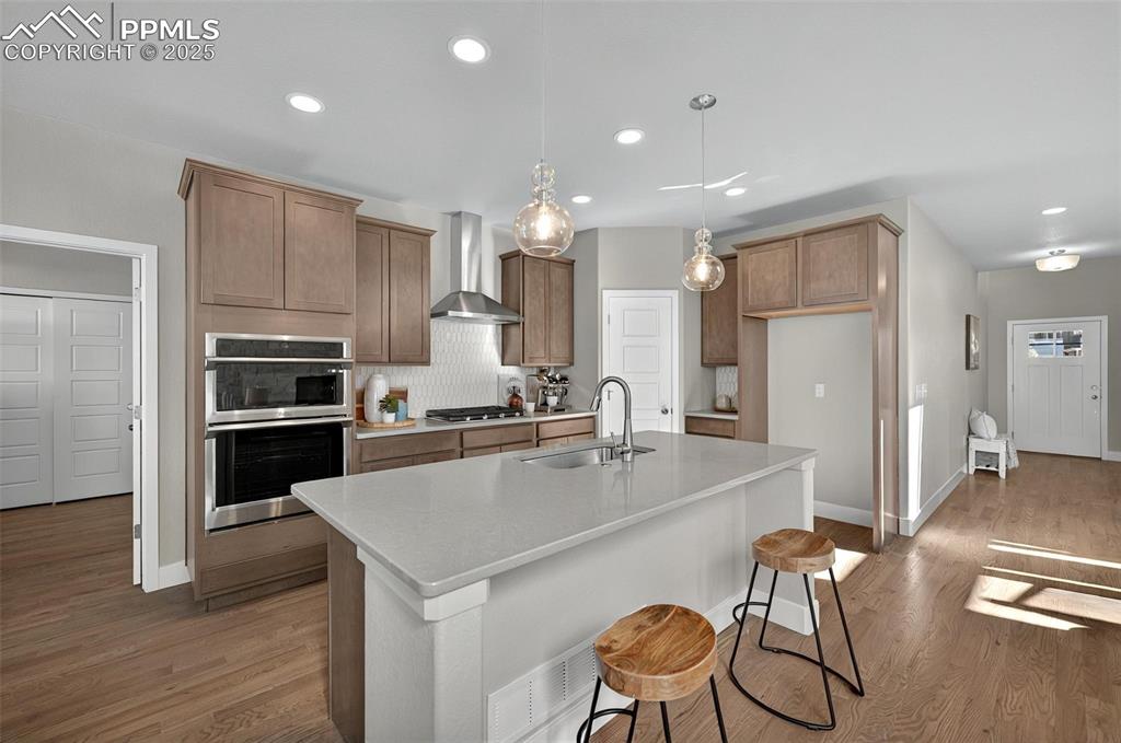 Image 10 of 49: Gas range and stainless steel hood!