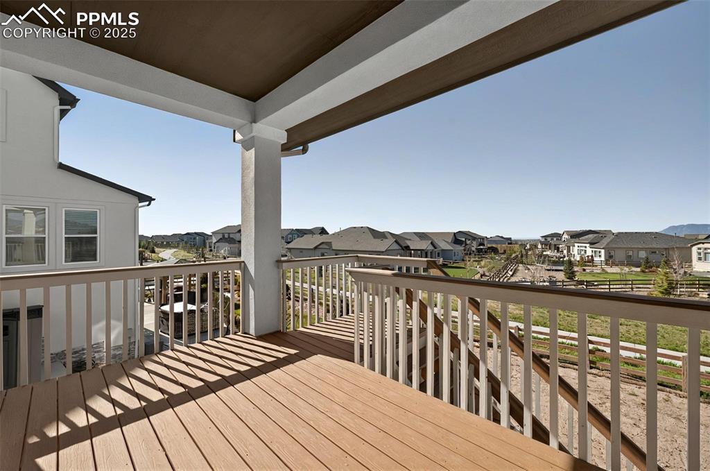 Image 15 of 49: Walk out to one of two covered decks!  Backs to open space!