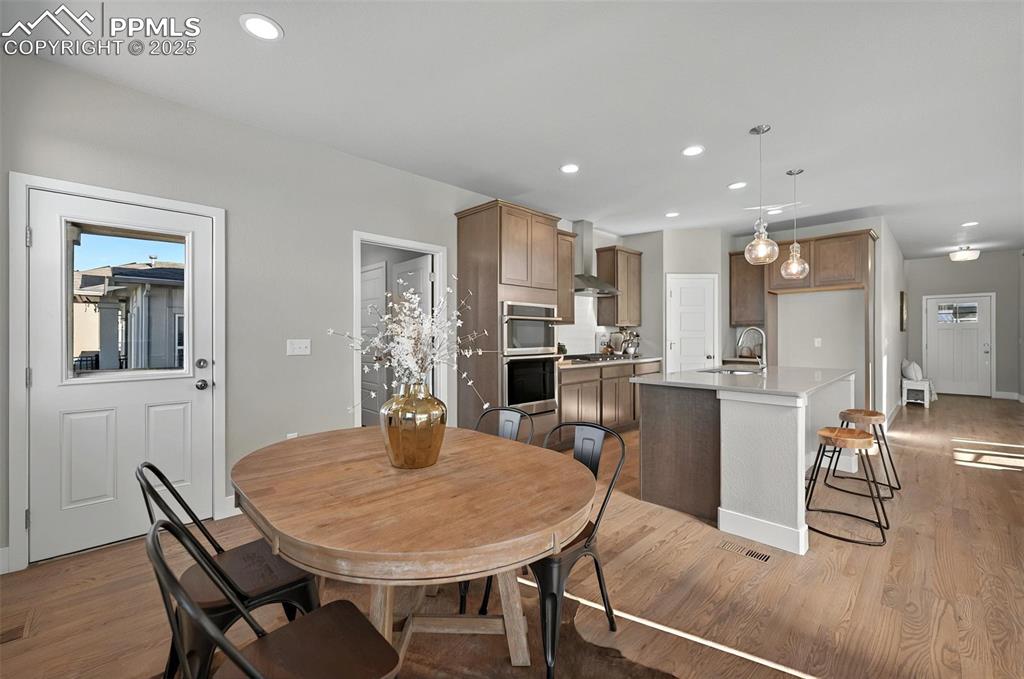 Image 16 of 49: Two doors to the dining area and two decks for enjoying the views!