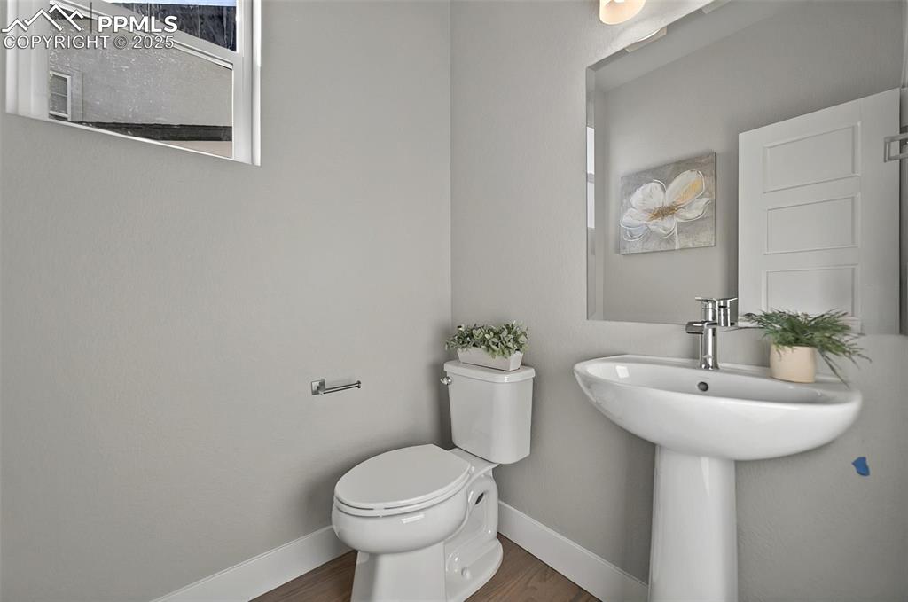 Image 23 of 49: Half bath on the main level!