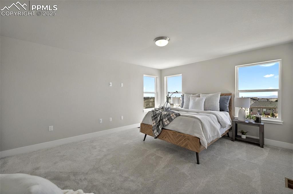 Image 27 of 49: Another view of this spacious master bedroom retreat!