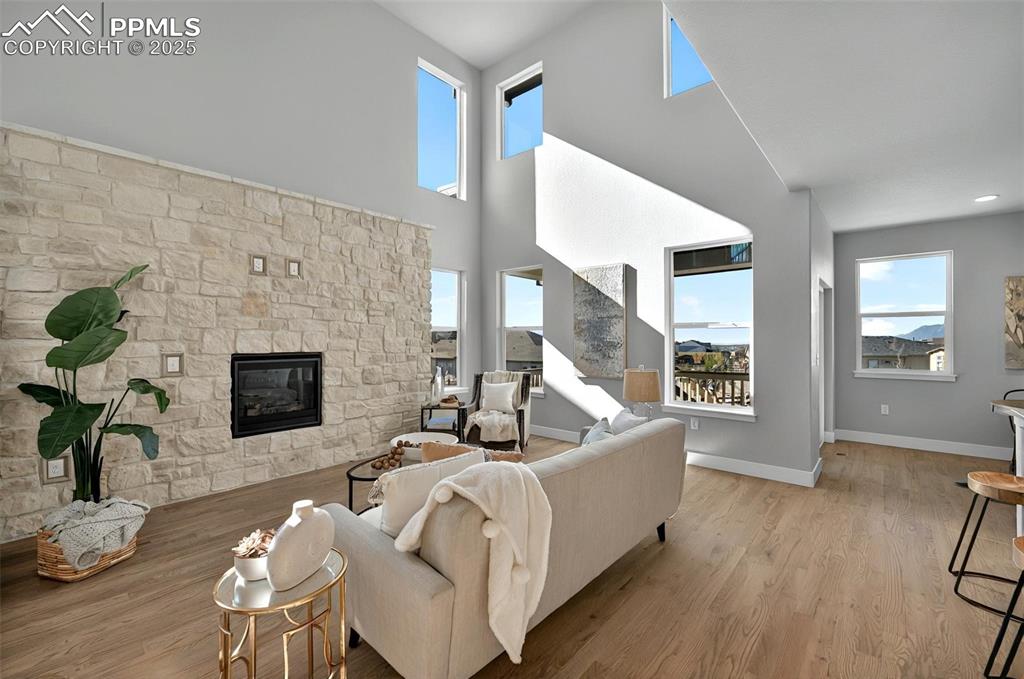 Image 6 of 49: Cozy family room with full width stone fireplace!