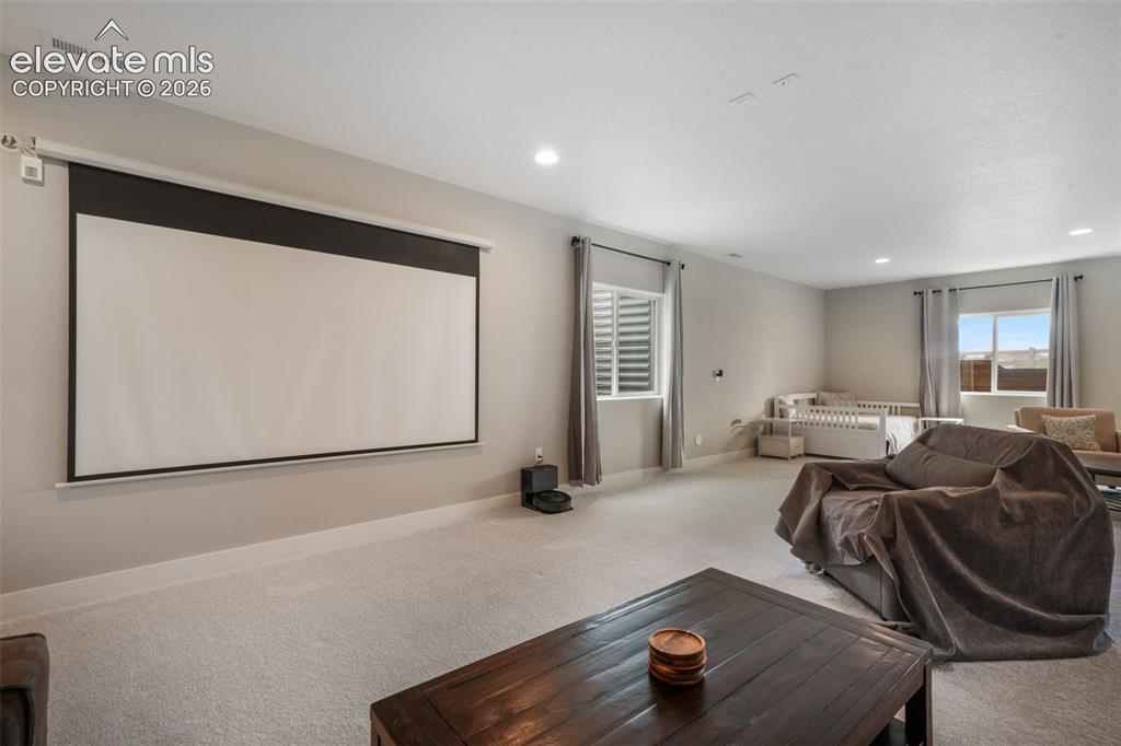 Image 41 of 50: Oversized basement with media area