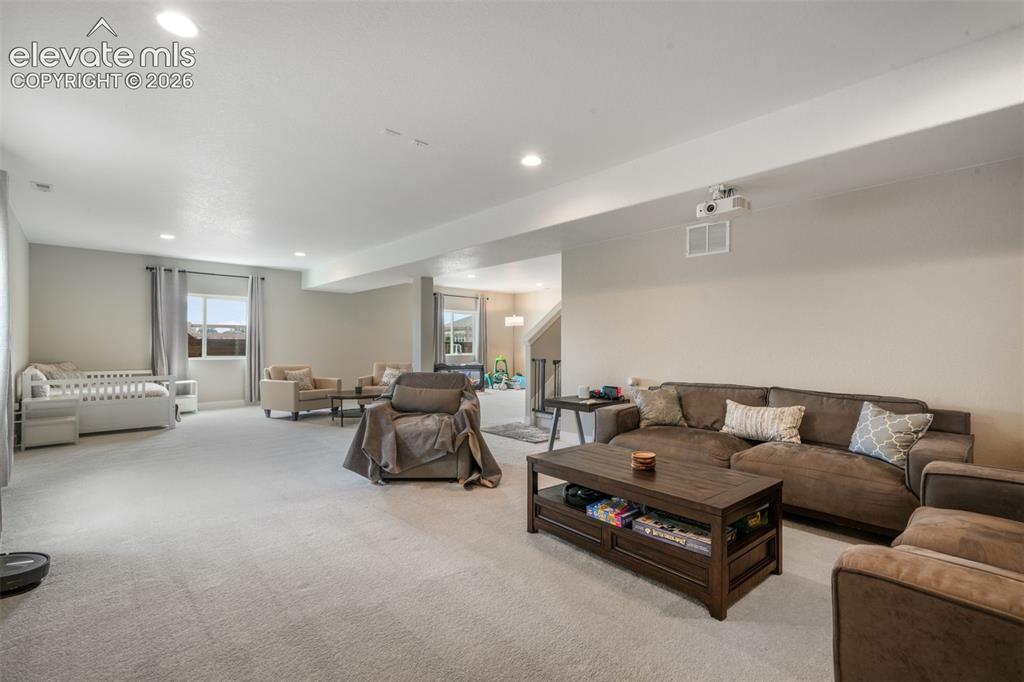 Image 42 of 50: Oversized basement with media area