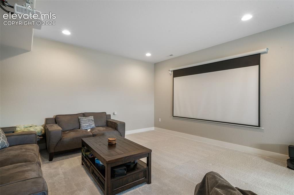 Image 43 of 50: Oversized basement with media area