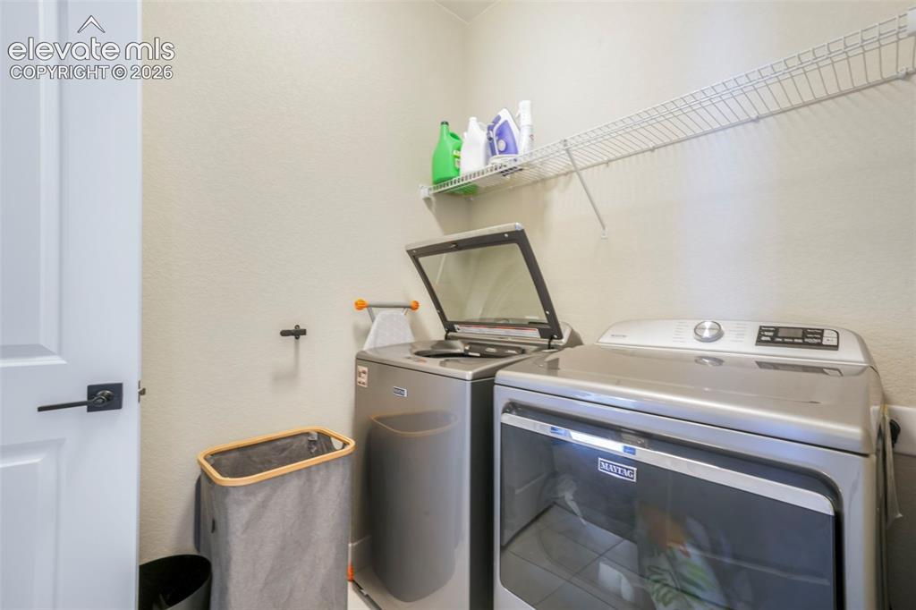 Image 45 of 50: Laundry room connects to primary bedroom