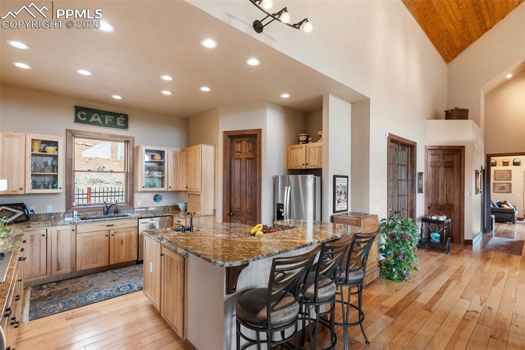 Image 14 of 47: Dining room and kitchen with walkout to porch,