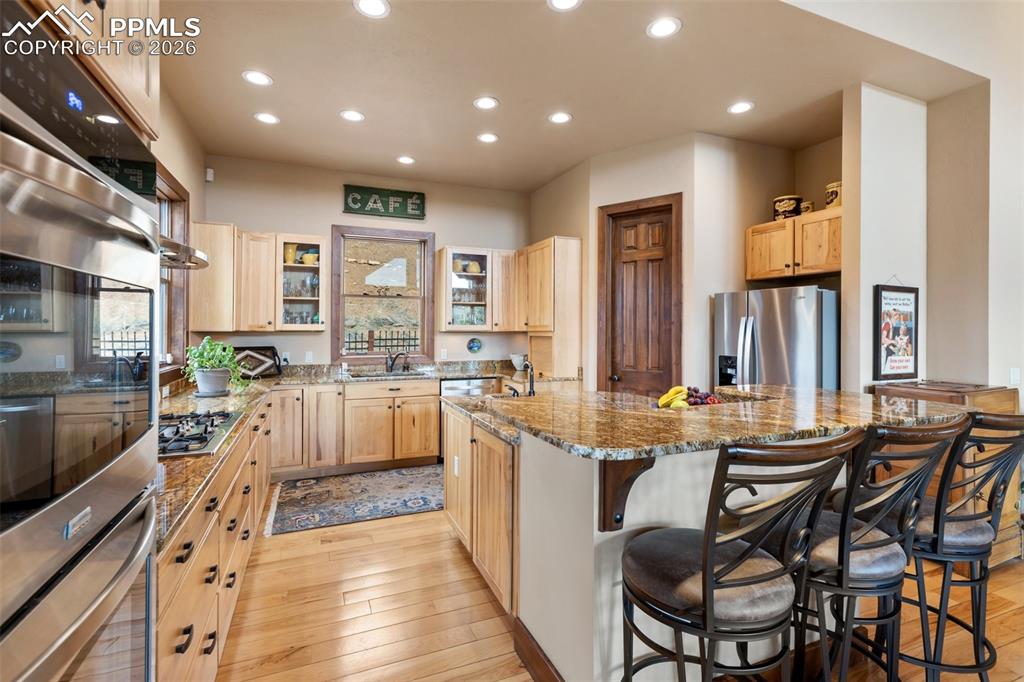 Image 18 of 48: Living and Dinging Room with View and walk out to porch